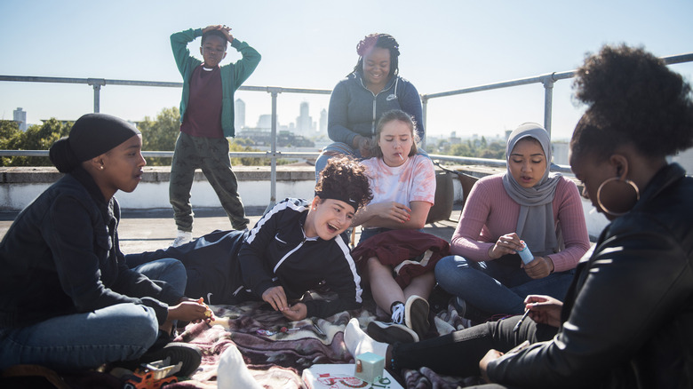 Rocks and her friends hanging out in Rocks (2021)