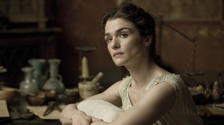 Agora sits and looks left