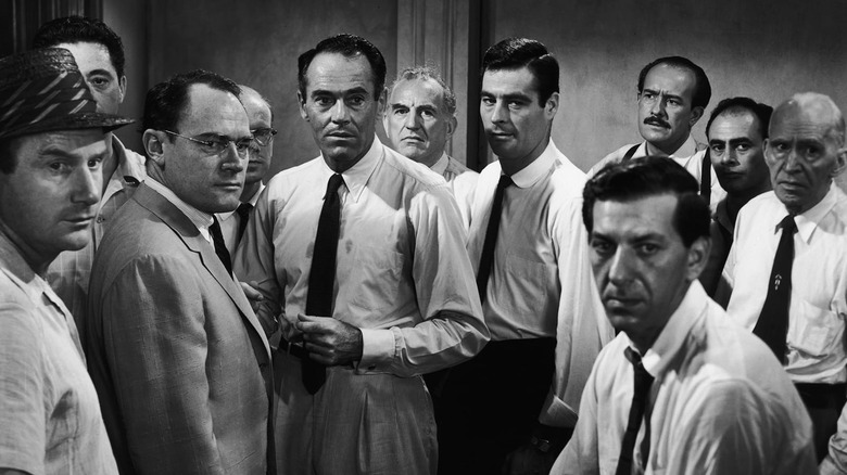 The titular jurors of 12 Angry Men looking around concerned (1957)