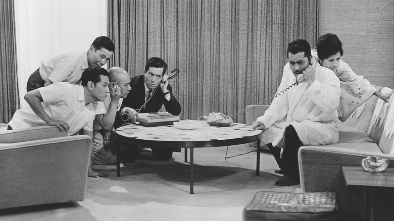 Kingo Gondo and others listening to kidnappers in High and Low (1963)