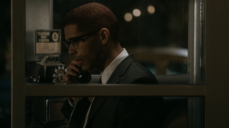 Malcolm X in telephone booth