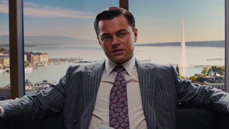 Jordan Belfort sits in chair