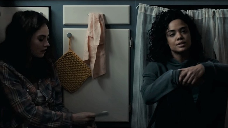 Lily James and Tessa Thompson sit