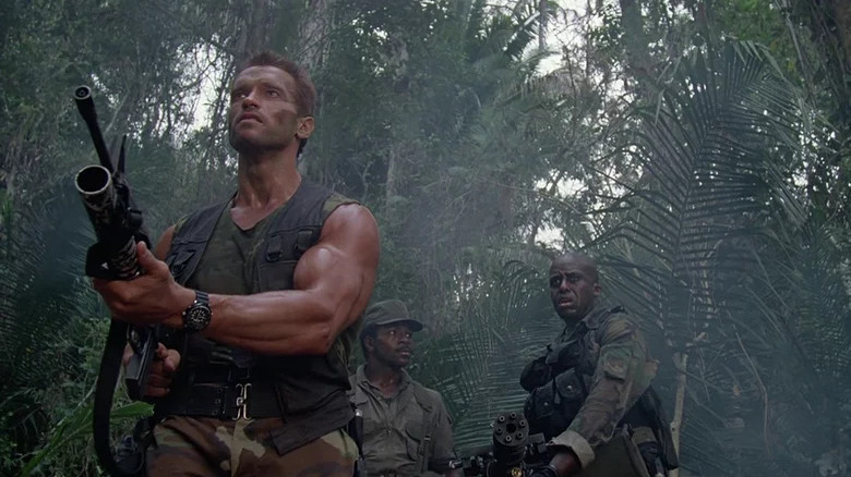 Arnold Schwarzenegger holds gun
