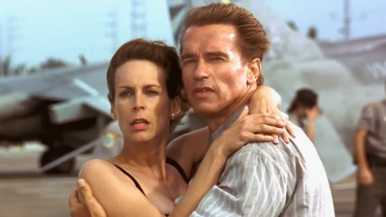 Arnold Schwarzenegger and Jamie Lee Curtis embrace