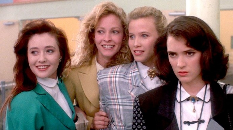 The Heathers behind Veronica in Heathers