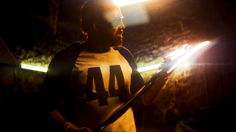 Red Miller preparing his vengeful weapons in "Mandy"