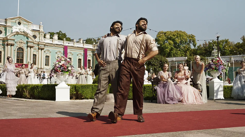 Komaram Bheem and Alluri Sitarama Raju dancing outside in "RRR"