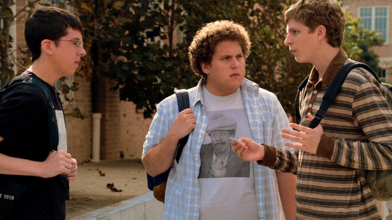 Seth and Evan looking at Fogell's fake ID in "Superbad" (2007)