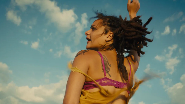 Star waving her arm and yelling in American Honey