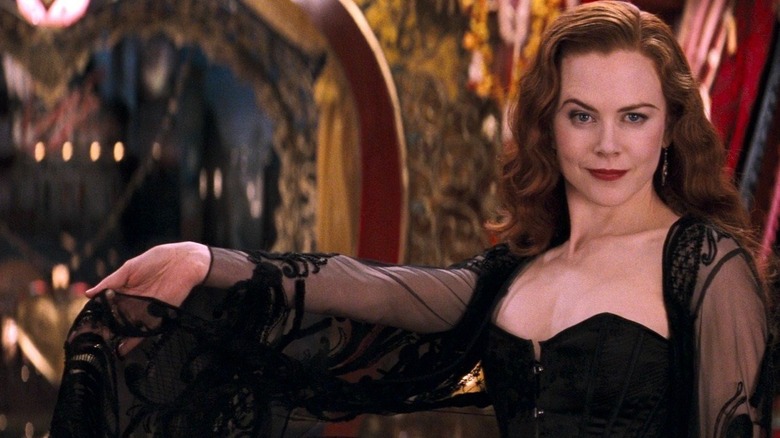 Satine raising an eyebrow and posing for Christian in Moulin Rouge