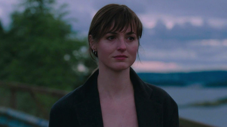 Julie with a sunset behind her in The Worst Person in the World