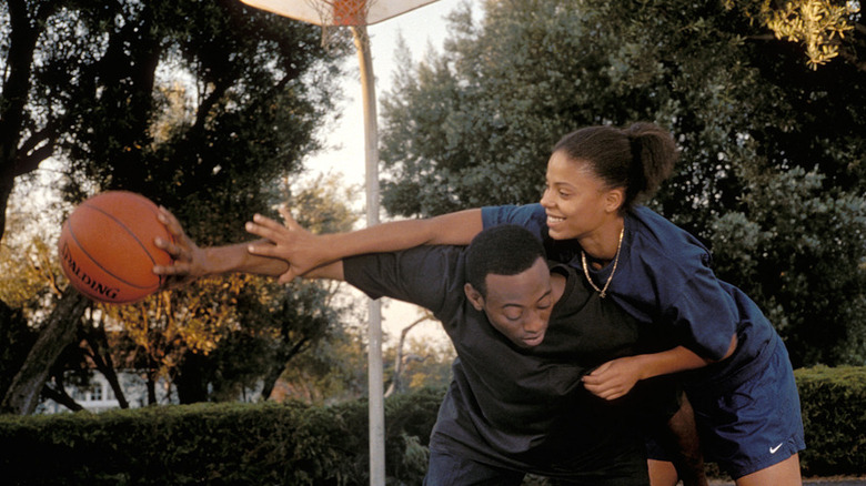 Quincy and Monica playing a.game of one-on-one basketball