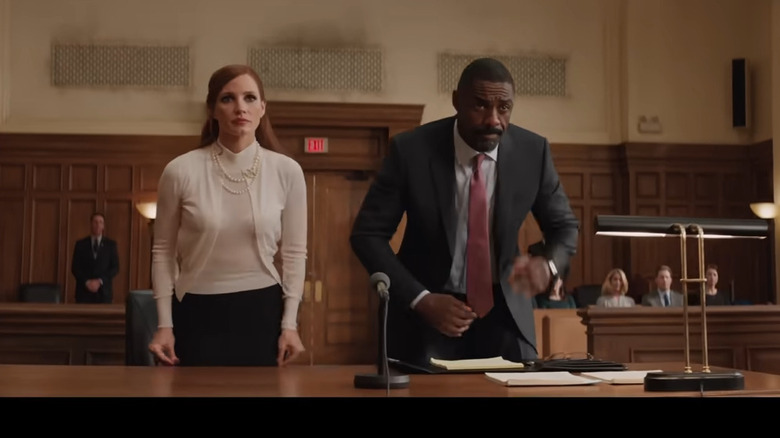Molly and her lawyer Charlie (Idris Elba) appearing in court