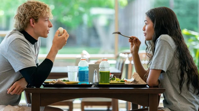 Art and Tashi at lunch after tennis practice at their college cafeteria in "Challengers" (2024)
