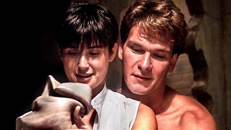 Molly works at the potter's wheel with Sam behind her in "Ghost" (1990)