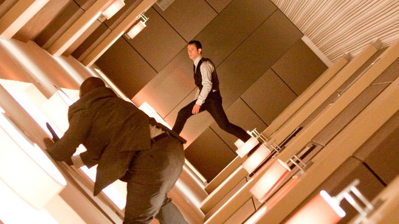 Arthur fights a man in a rotating hallway in "Inception" (2010)