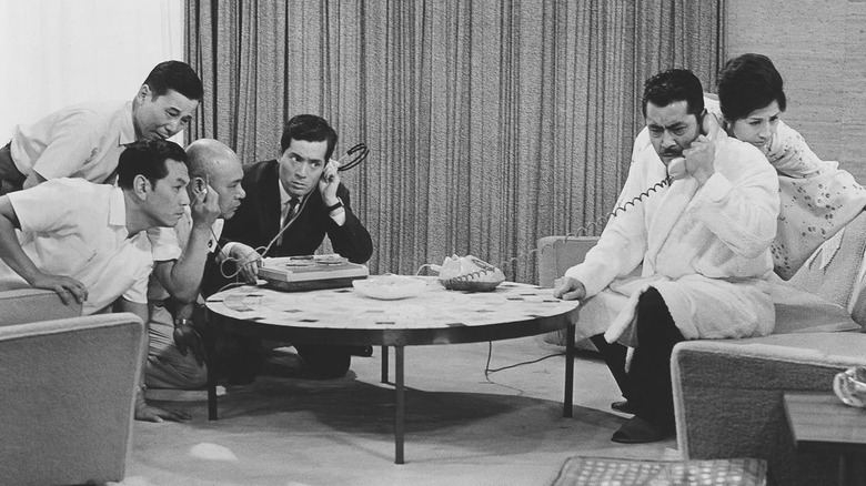 Officers listen in as Gondo talks on the phone in "High and Low" (1963)