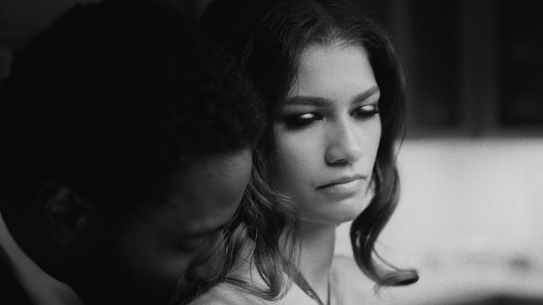 Malcolm kissing Marie's shoulder