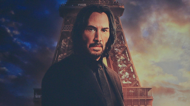 John Wick in front of the Eiffel Tower