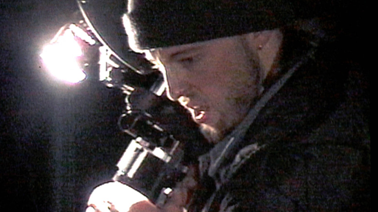 Josh holding a camera in "The Blair Witch Project" (1999)