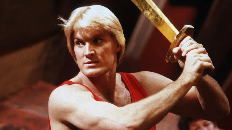 Flash Gordon with a golden sword in "Flash Gordon"