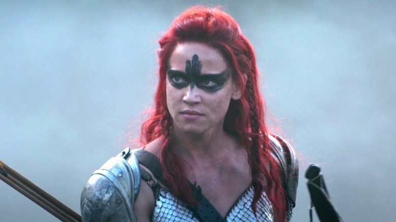 Red Sonja wearing armor and face paint in "Red Sonja"