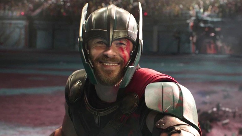 Thor smiling during a gladiator fight on Sakaar in "Thor: Ragnarok"