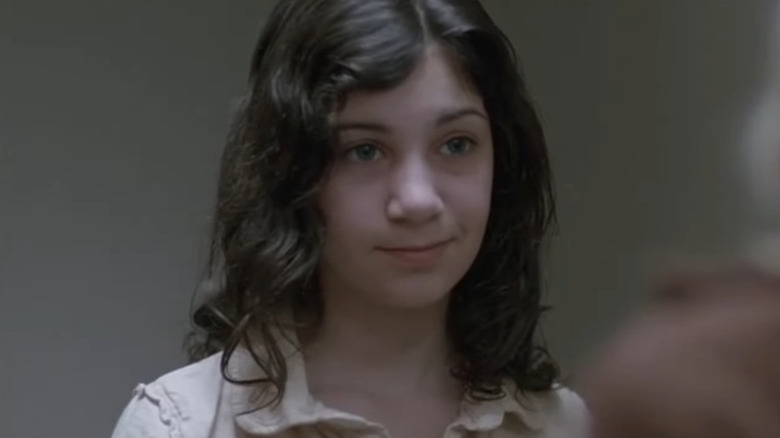Eli smiling in "Let the Right One In" (2008)