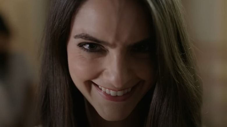 Caitlin Stasey smiling creepily