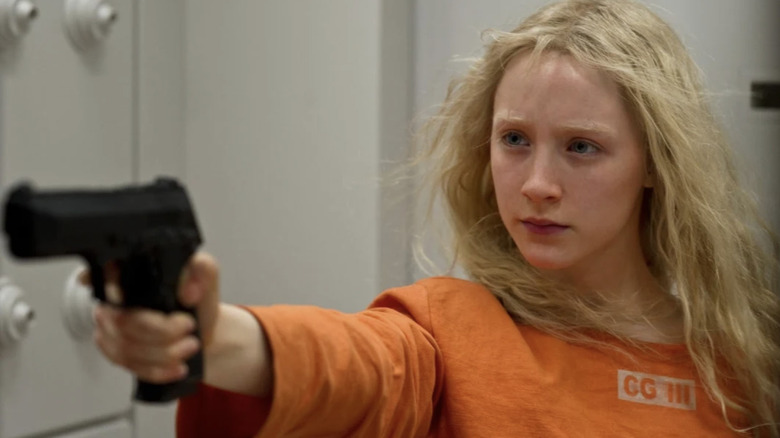 Hanna aims her gun in "Hanna" (2011)