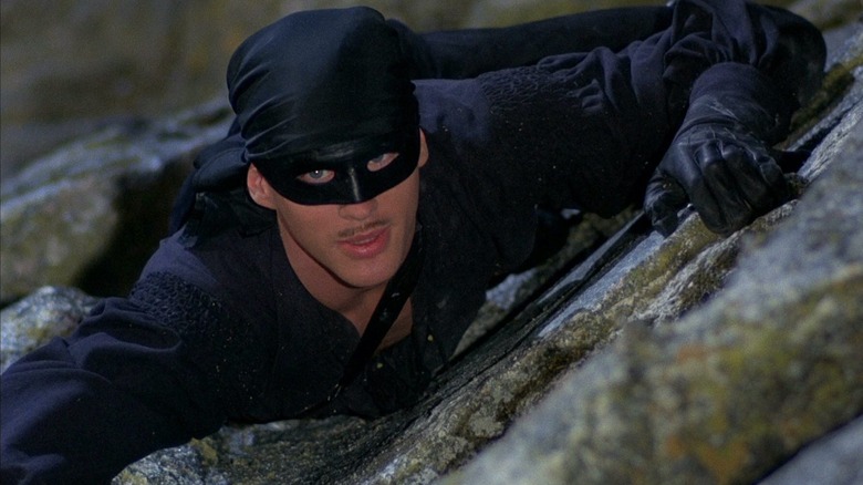 Westley climbing up rock face as Dread Pirate Roberts