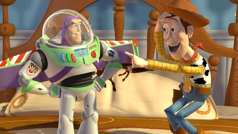 Woody pointing at Buzz and laughing in Toy Story
