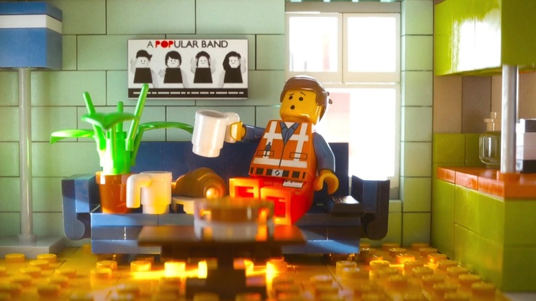 Emmet Brickowski sitting on the couch in The Lego Movie