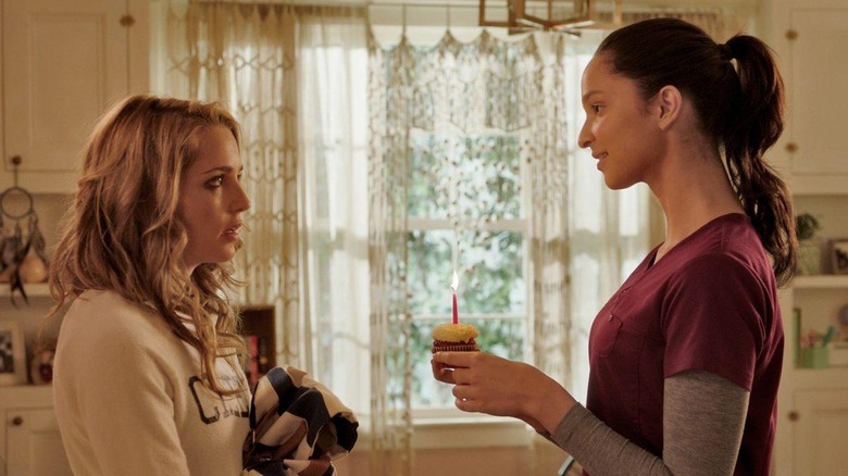 Lori giving Tree a cupcake in Happy Death Day