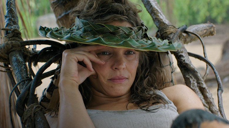Linda peeking out from under a woven hat in Send Help