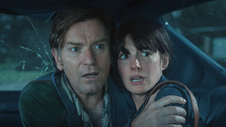 Greg and Denise huddled in the car together in The End of Oak Street