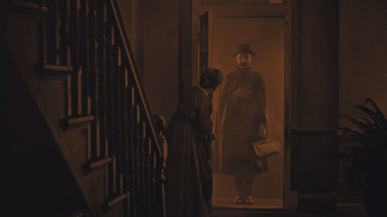 The lodger framed in doorway