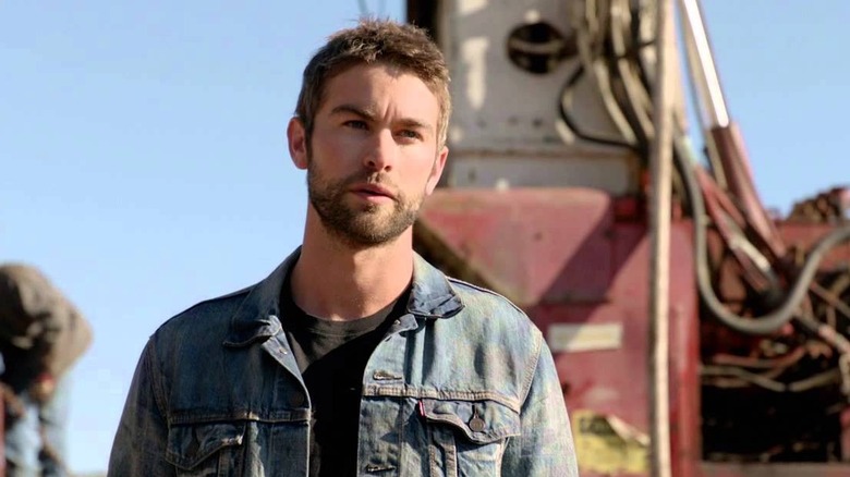 Billy LeFever stands in front of an oil rig on "Blood and Oil" (2015)