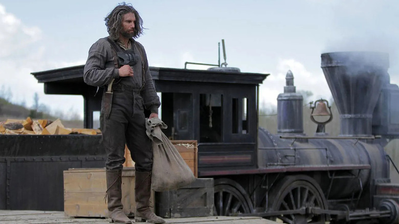Cullen Bohannon stands on a railroad platform in "Hell on Wheels" (2011-2016)