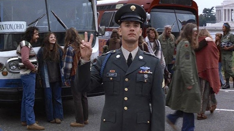 Forrest flashing a peace sign