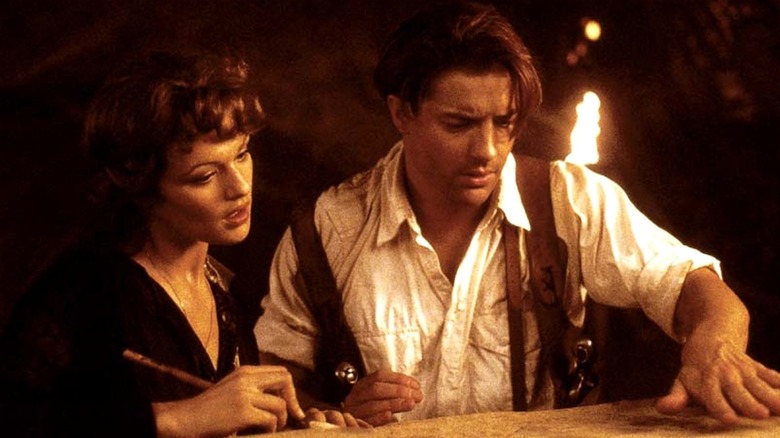 Rick and Evelyn reading an ancient tablet in 