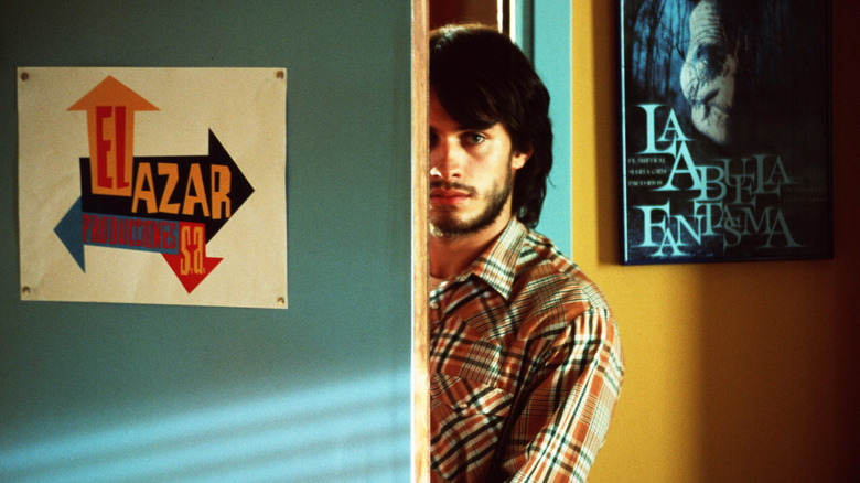 Angel standing behind door