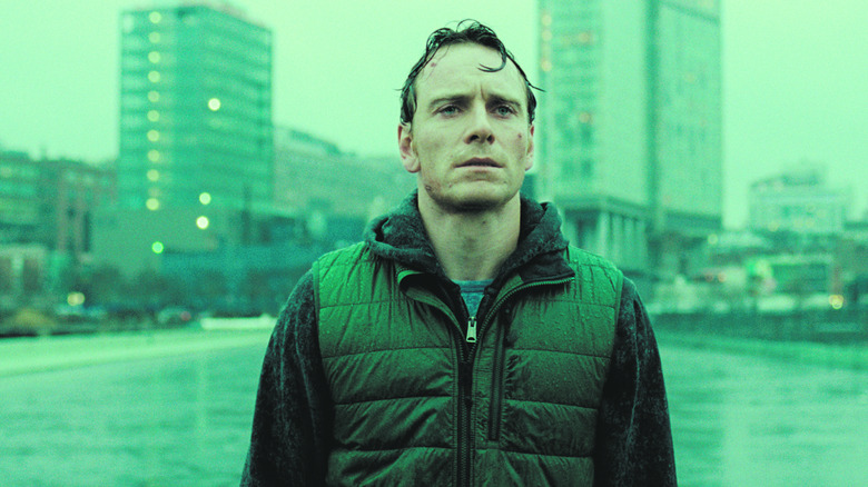 Brandon standing outside in the rain