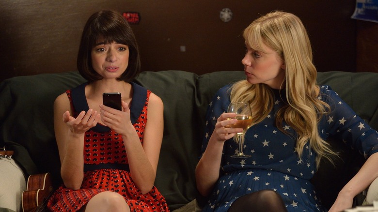 Garfunkel and Oates on sofa