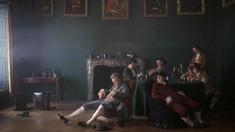 A group of characters in Barry Lyndon (1975) sitting lazily in a room together