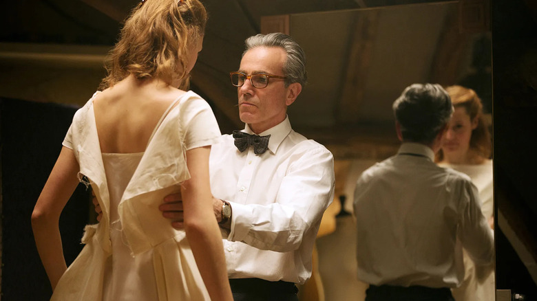 Daniel Day-Lewis as Reynolds Woodcock dressing Lesley Manville as Cyril in Phantom Thread (2017)