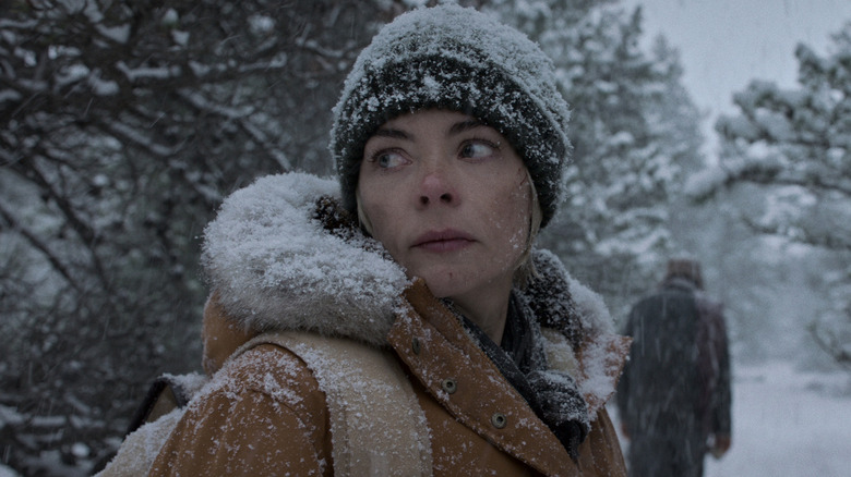 Rose in the snow looking behind her in Black Summer (2019-2021)