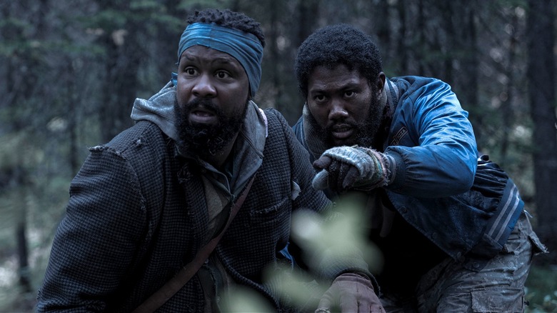 Braithwaite and Spears on the lookout behind a bush in Black Summer