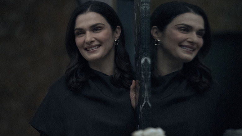 Beverly smiling into a mirror on Dead Ringers
